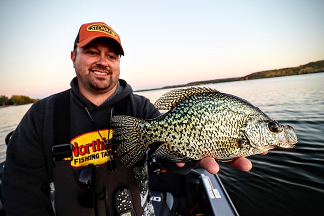 Fishing Angler holding crappie