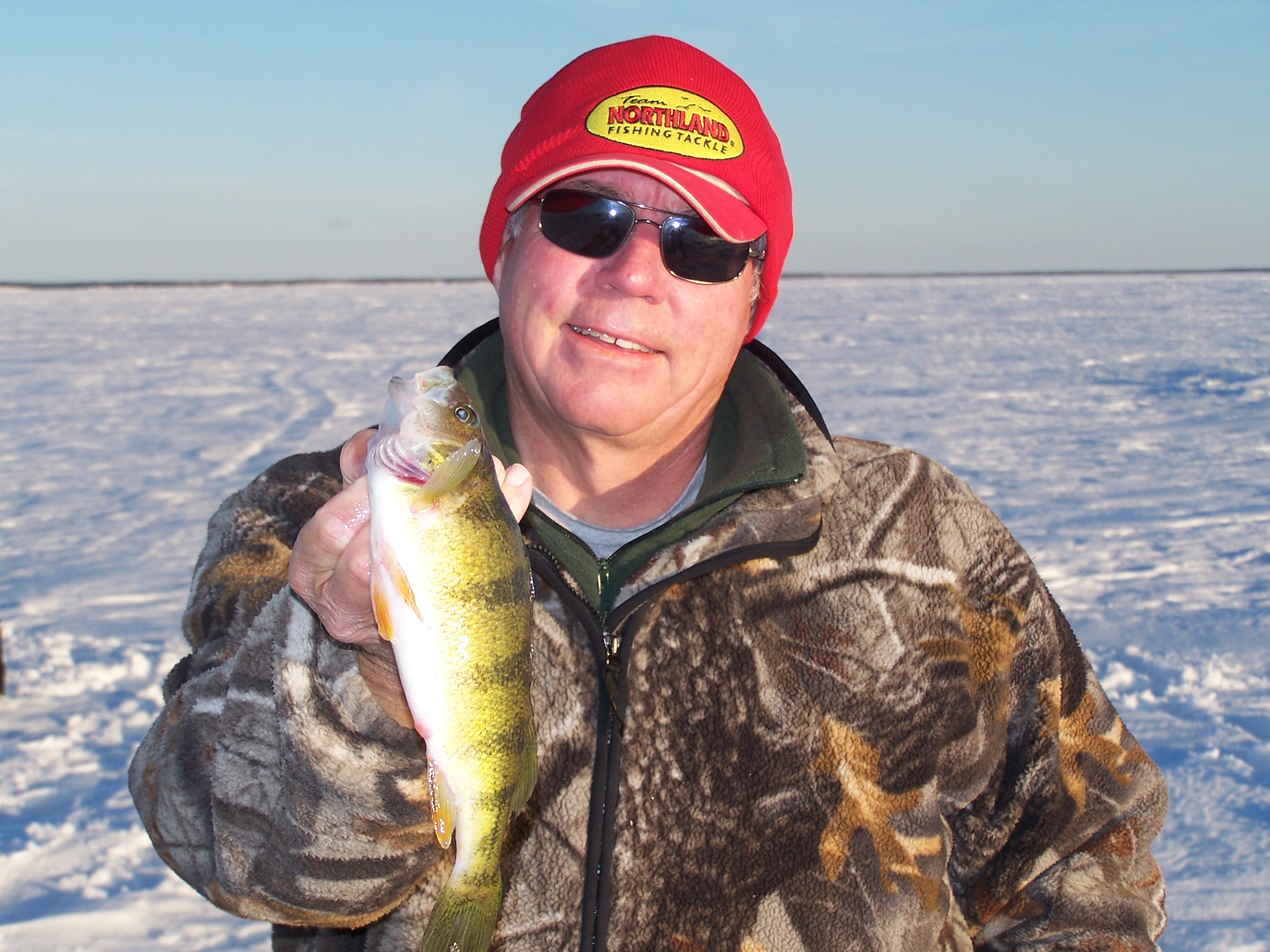 Duane Peterson with a perch caught ice fishing