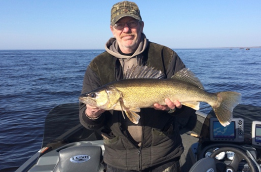 Fisherman with a Green Bay walleye