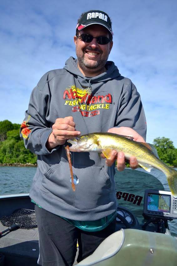 Angler with a walleye caught on a spinner rig