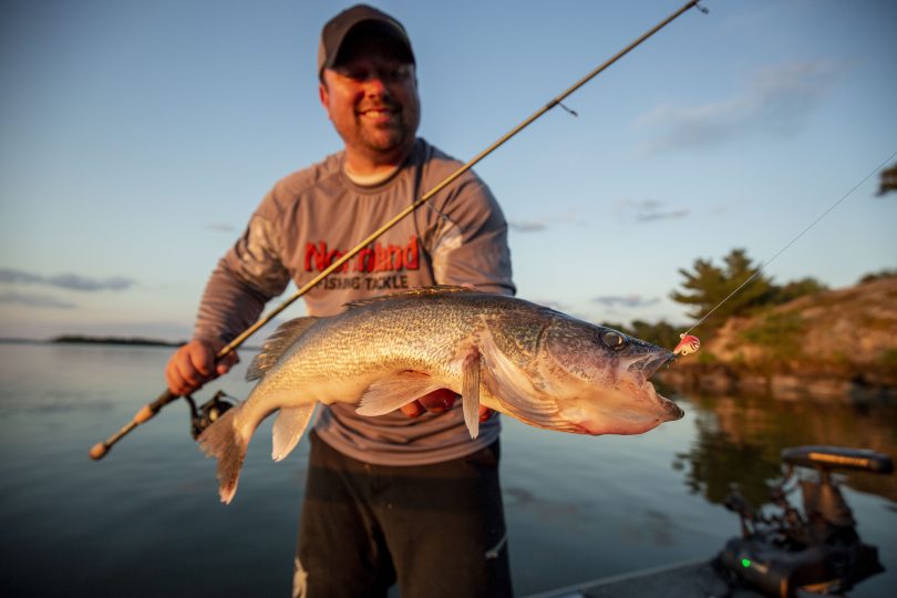 Fishing Angler holding Walleye