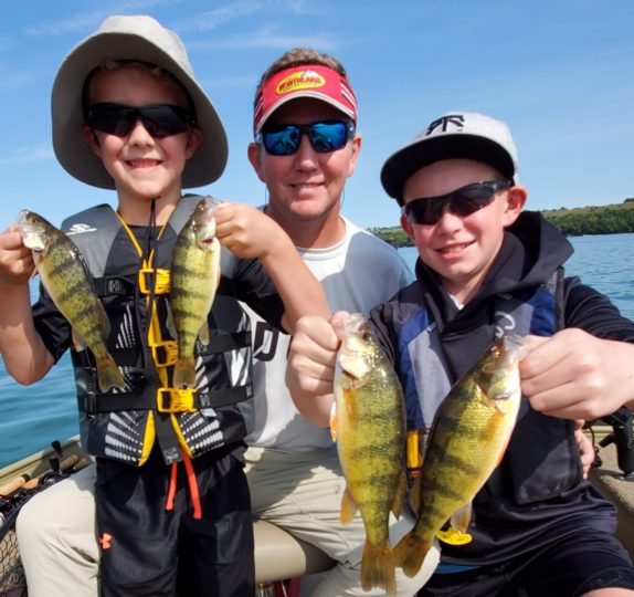 Fisherman Showing Off Yellow Perch They Caught.