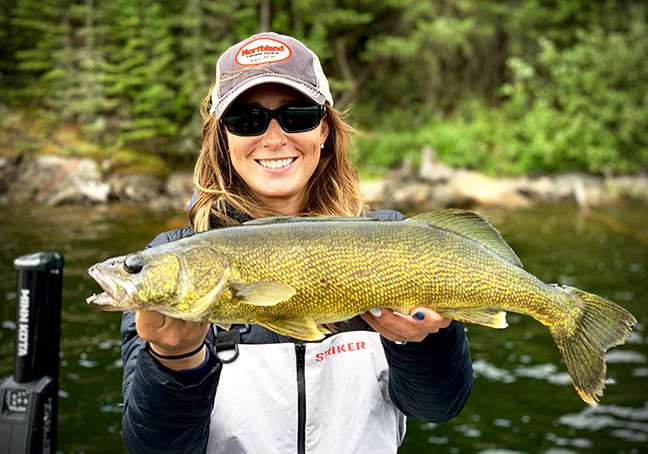 Angler holding Walleye