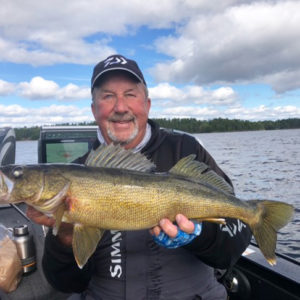 Fishing Angler holding walleye fish