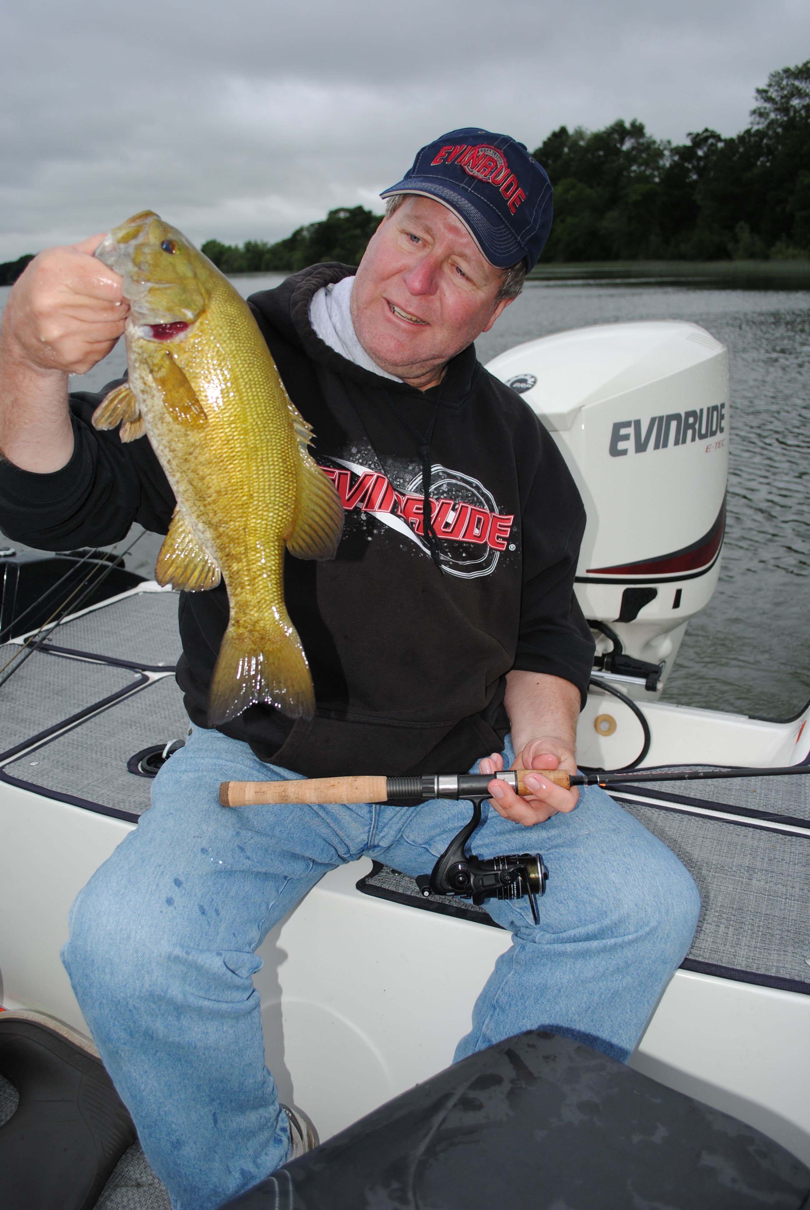 Bob Jensen holding a smallmouth he caught, was selected for the Fresh Water Fishing Hall of Fame