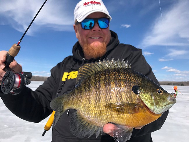 Brian 'Bro' Brosdahl with a big bluegill he caught ice fishing.