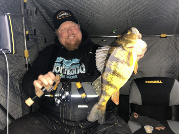 Brian 'Bro' Brosdahl with a perch he caught ice fishing