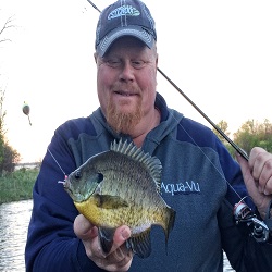 Bro with a bluegill he caught under a bobber