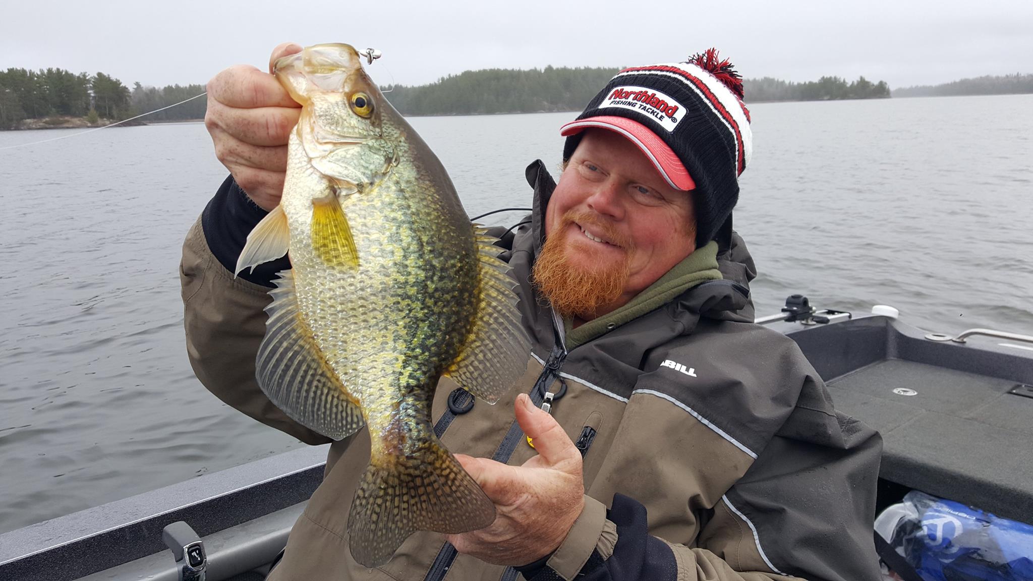 Brian 'Bro' Brosdahl holding up a crappie he caught fishing in the spring.