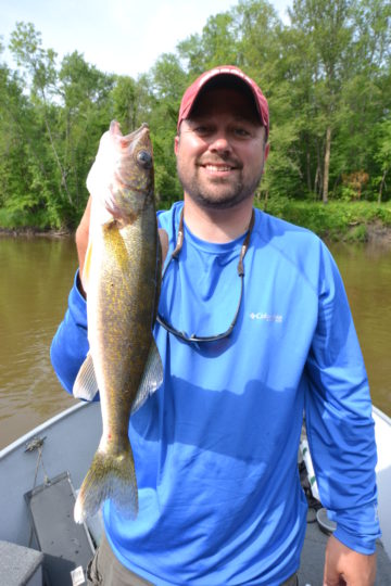 Angler with a summertime walleye