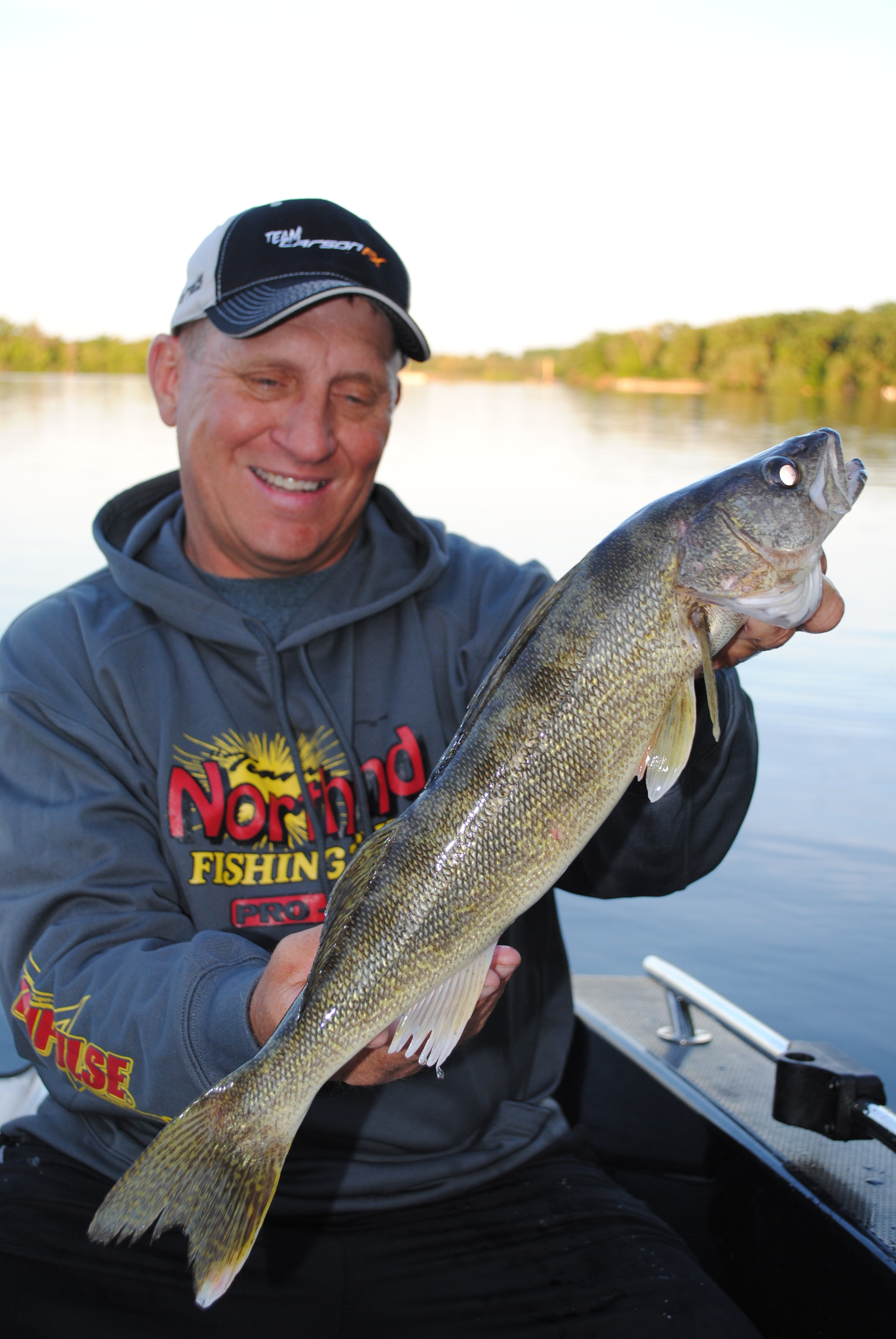 Mike Frisch holding up a walleye he caught on a Northland Tackle jig