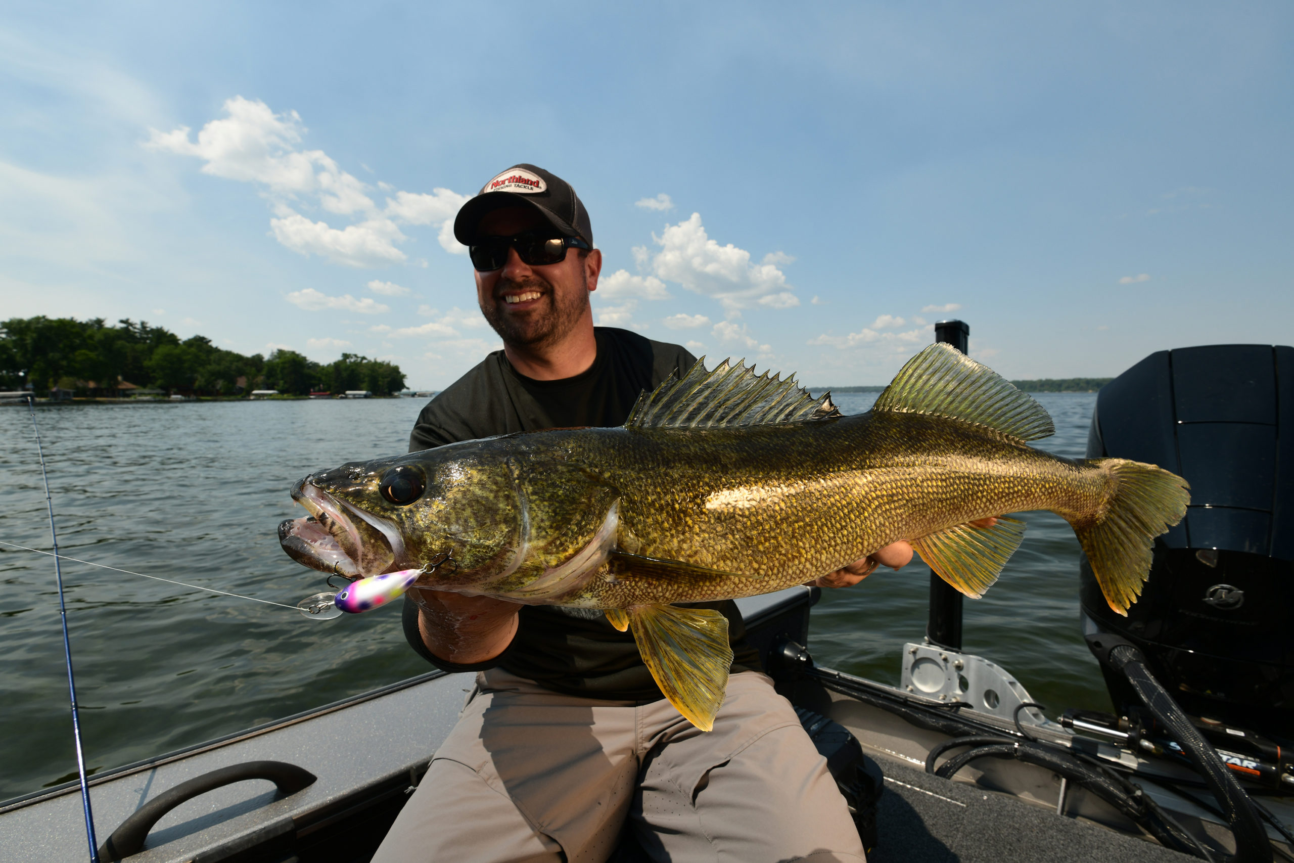 Angler with a big walleye caught on a Rumble Bug crankbait.