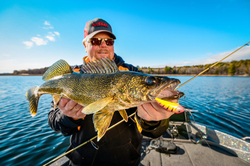 Brian 'Bro' Brosdahl holding up a walleye he caught on the Rumble Shad crankbait