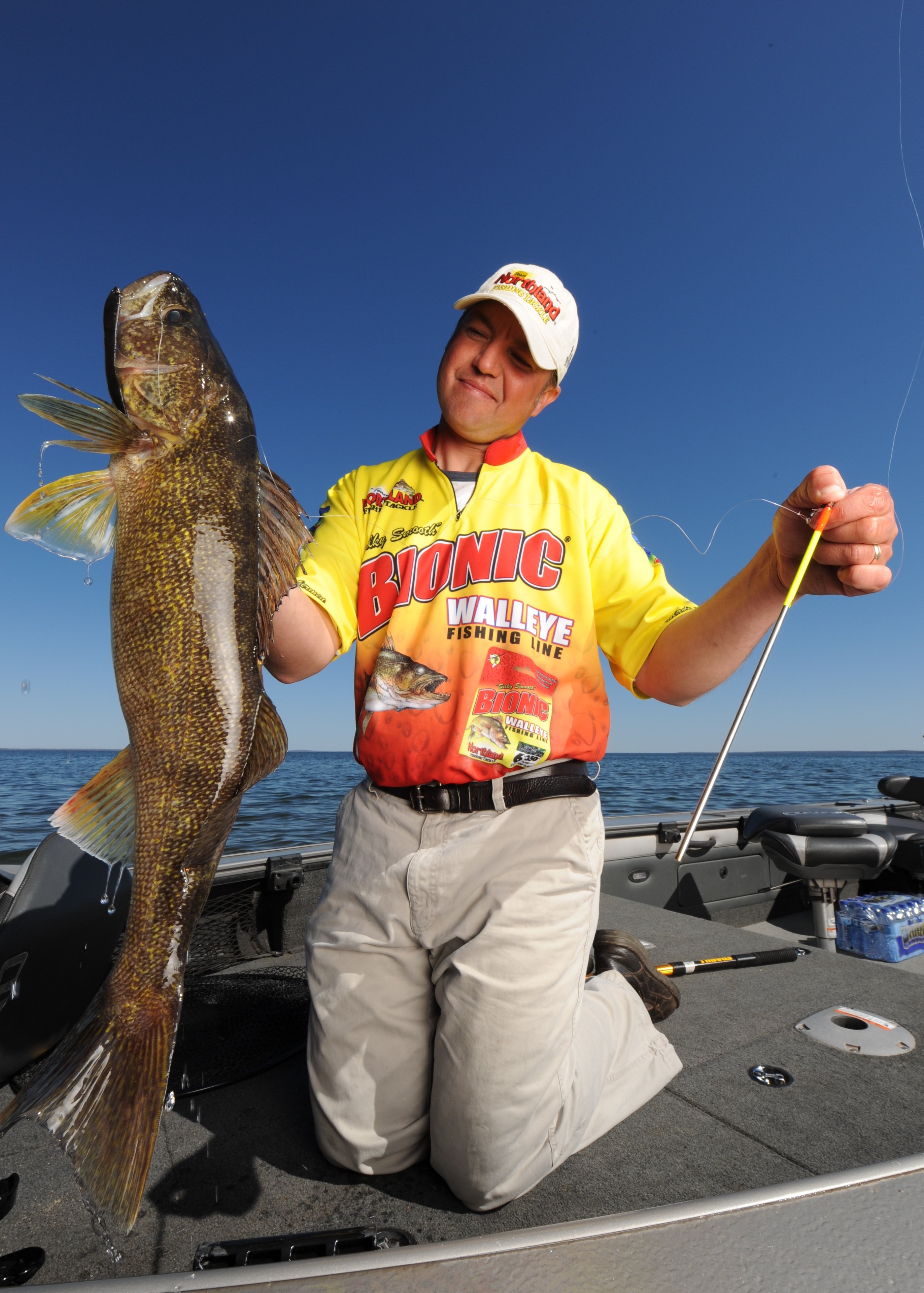 Tony Roach holding up a big walleye