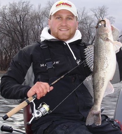 An early spring walleye being shown off by a fisherman.