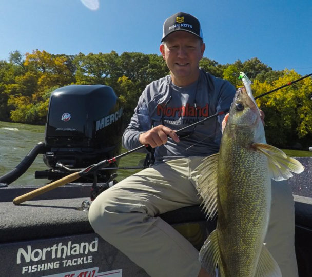 Walleye fisherman holding up a walleye caught on the Rippin' Minnow