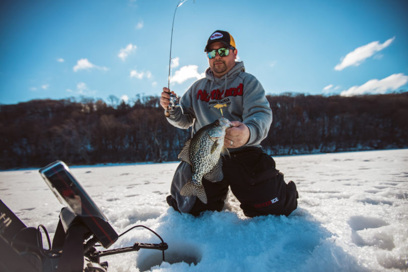 Ice fisherman catching a crappie on a Bro Bug Spoon