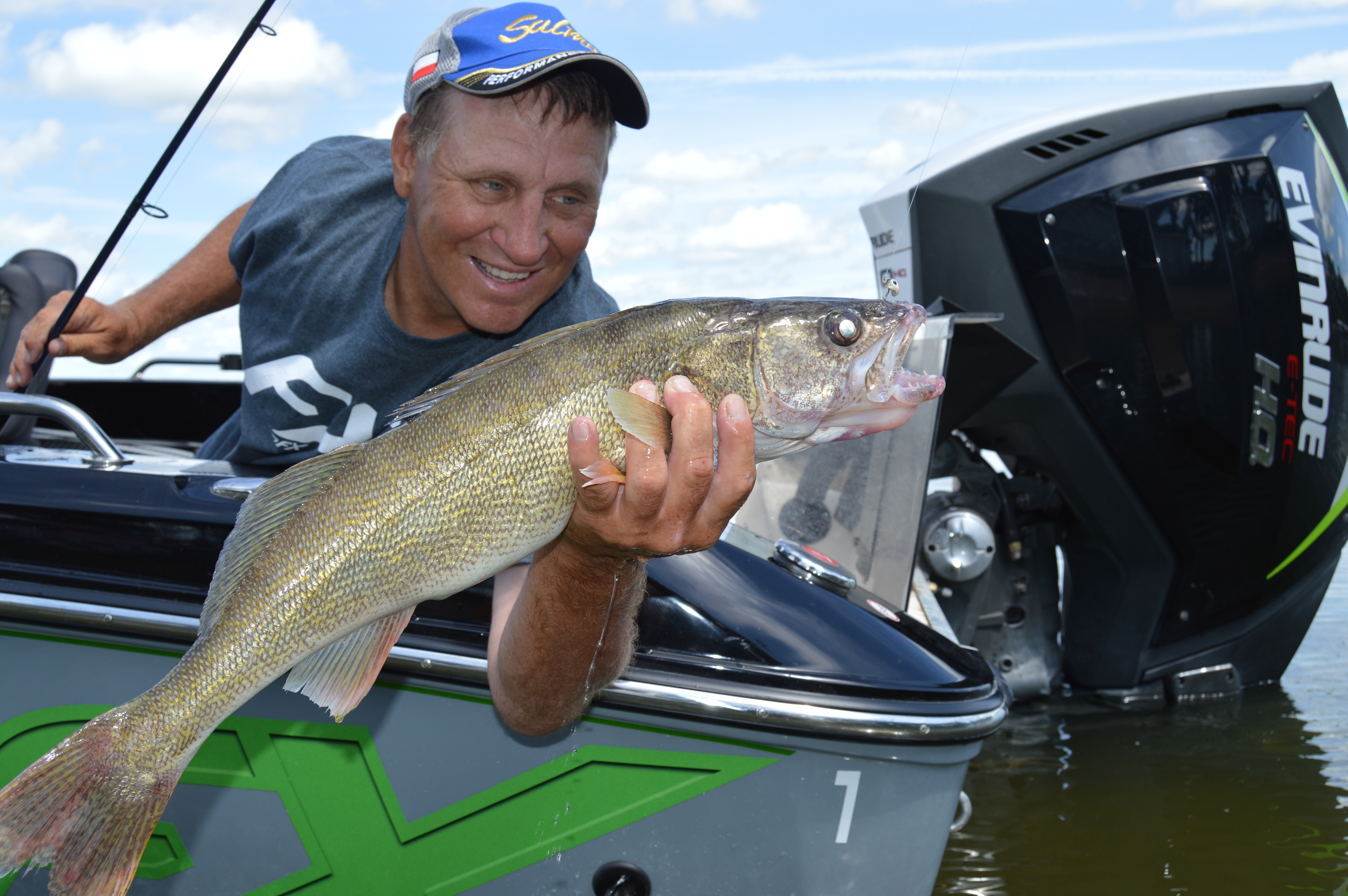 Mike Frisch holding a walleye caught on a Northland Fishing Tackle Fire-Ball Jig.