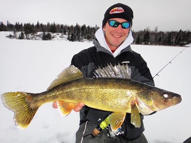 Gussy ice fishing for walleye