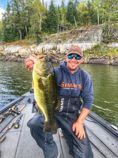 Gussy holding up a big largemouth caught on a Bagley crankbait