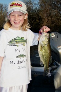 Young Fisherman holding up a largemouth bass