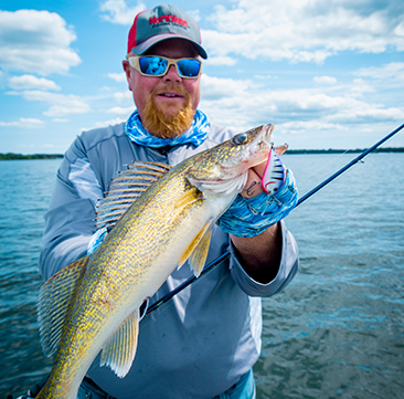 Brian 'Bro' Brosdahl holding up a walleye he caught fishing a Northland Fishing Tackle crankbait.