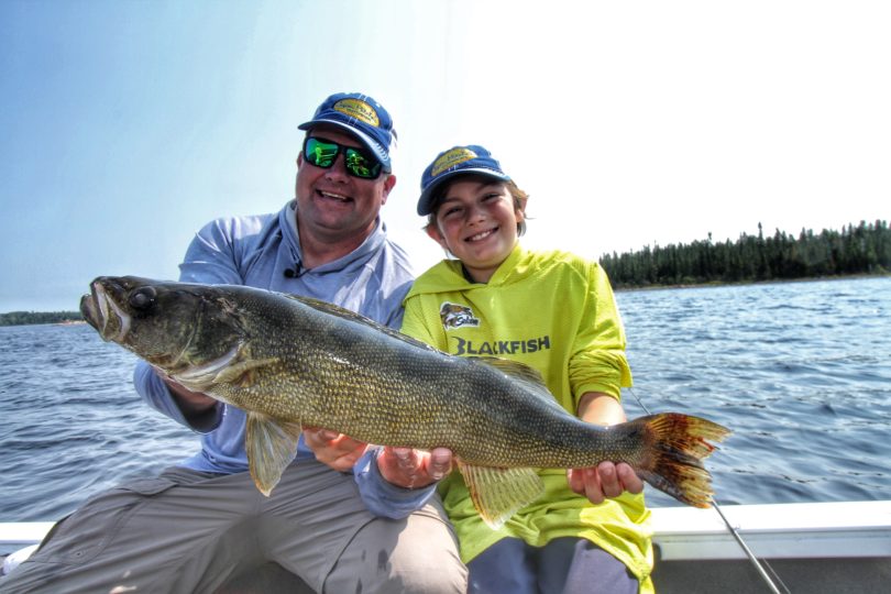 Jason Mitchell and son with a big walleye