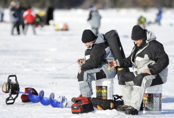Two anglers ice fishing