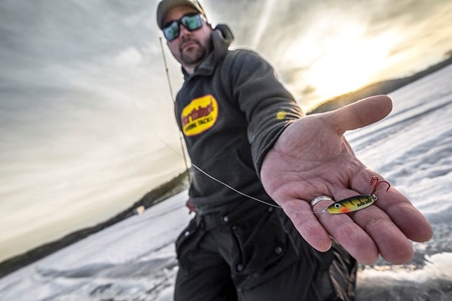 Northland Fishing Tackle Buck Shot Spoon in an anglers handing ice fishing.