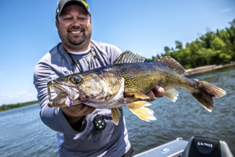 Joel Nelson with a walleye he caught fishing.