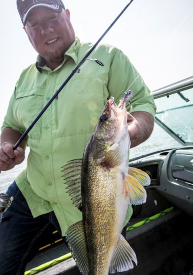 Fisherman catching a walleye on a jig