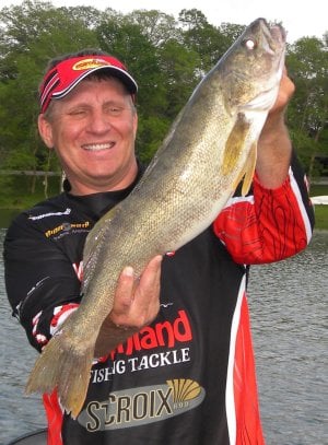 Mike Frish holding a summer walleye