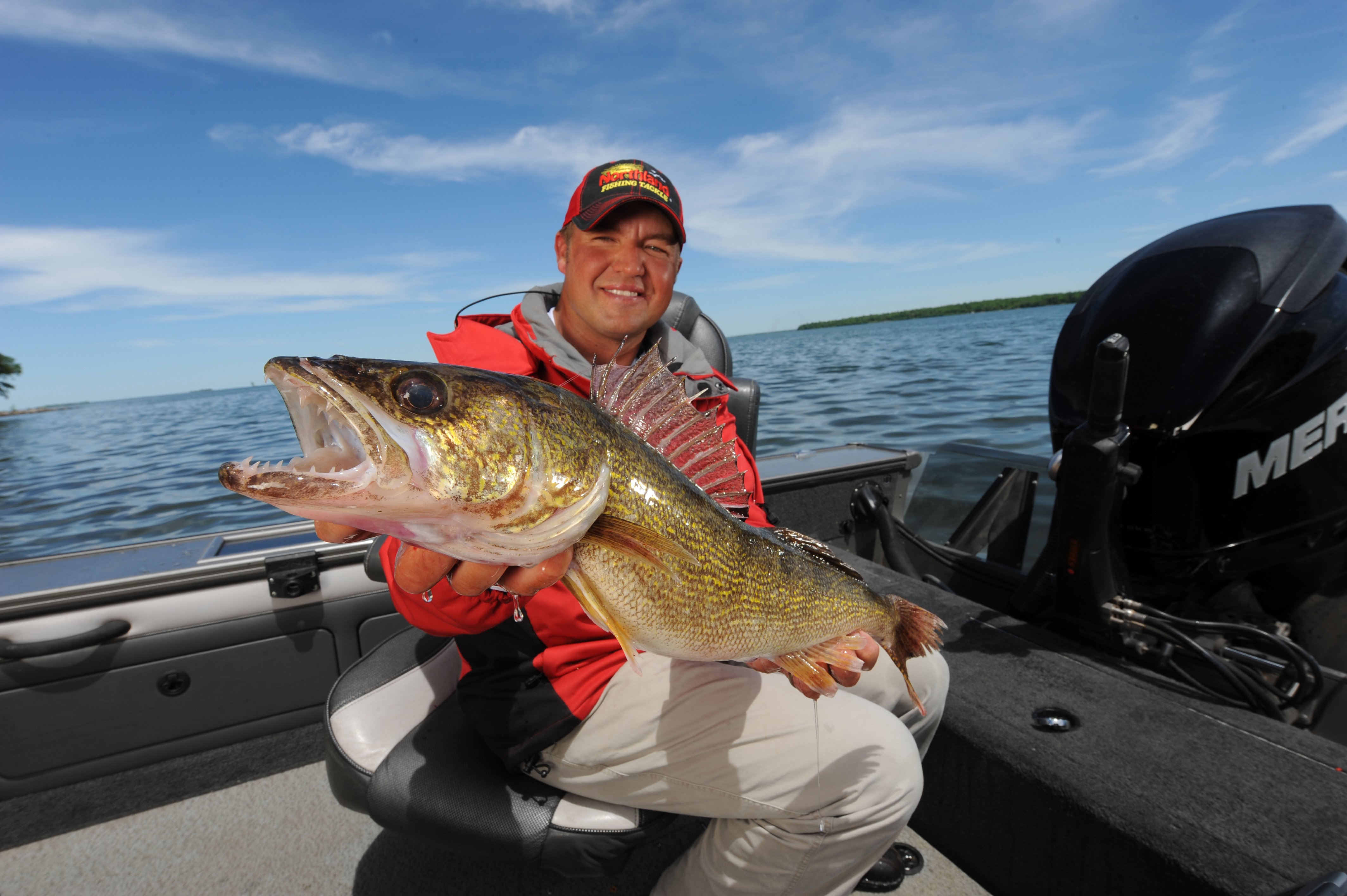 Tony Roach holding up a big open water walleye.