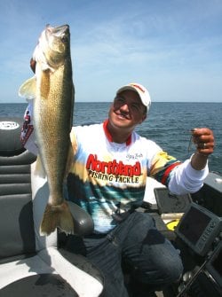 Tony Roach holding up a walleye
