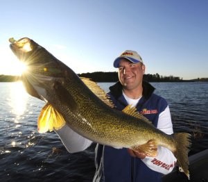 Tony Roach holding a walleye caugt on live bait