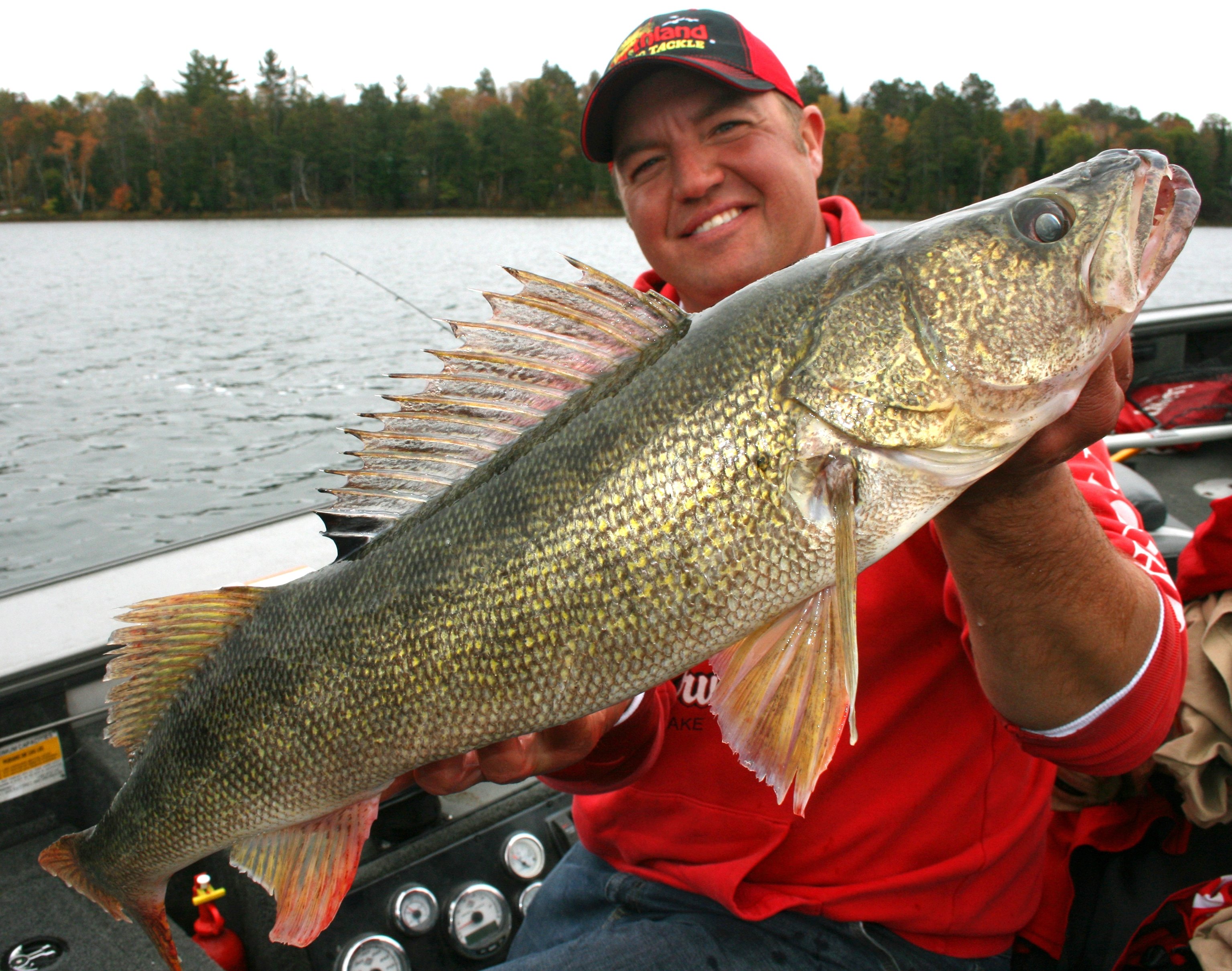 Tony Roach holds up a big walleye he caught