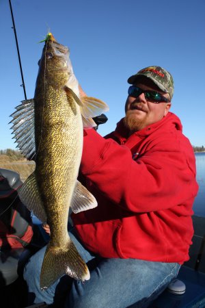 Bro holding up a walleye he caught on a Northland Jig