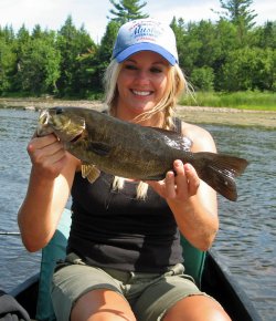 A nice smallmouth bass caught while fishing in a canoe.