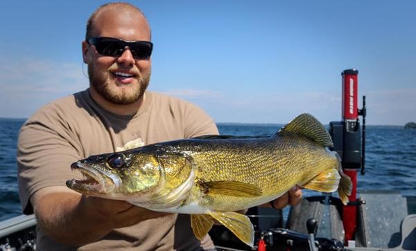 Open water, big walleye caught by a fisherman.