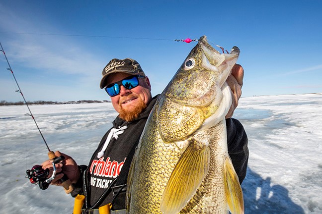 Bro ice fishing for walleye