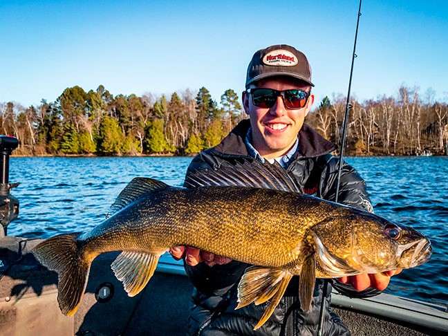 Fisherman holding Deep-Vee Bucktail Walleye