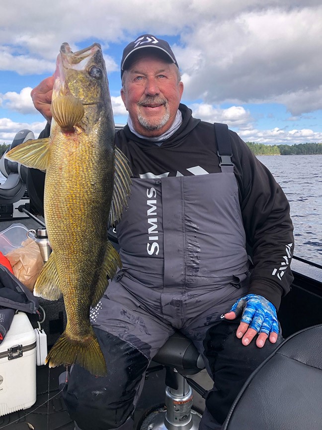 Fishing Angler holds walleye