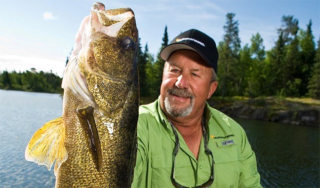 Fishing Guide holds walleye