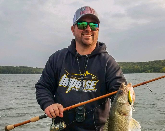 Fisherman with a walleye he caught on the Rumble Shad crankbait.