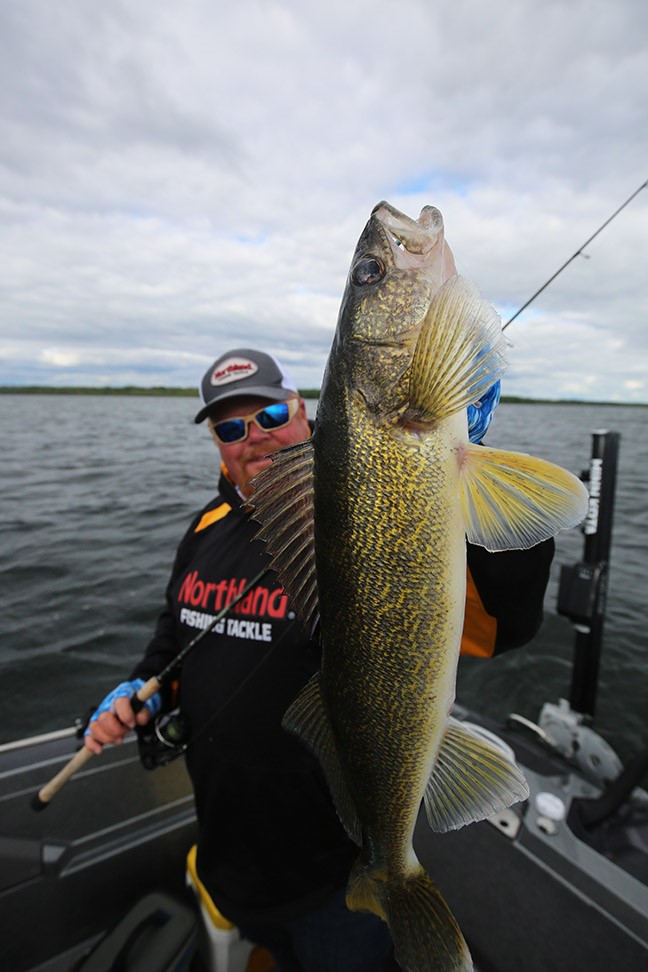 Angler holding walleye