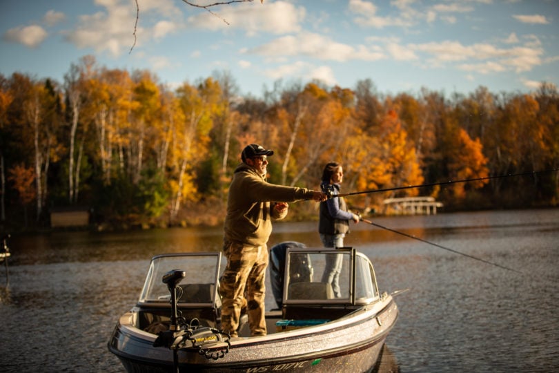 Two anglers fishing in the fall