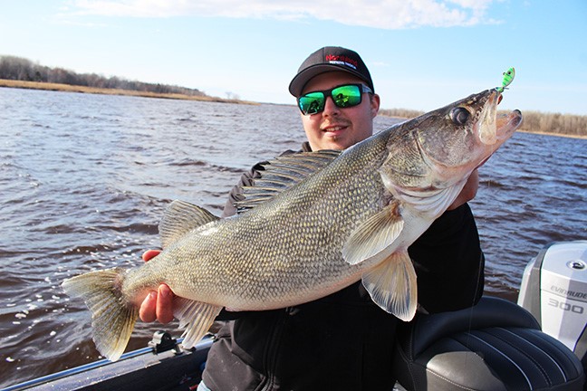 Fisherman with a big walleye he caught on a jig