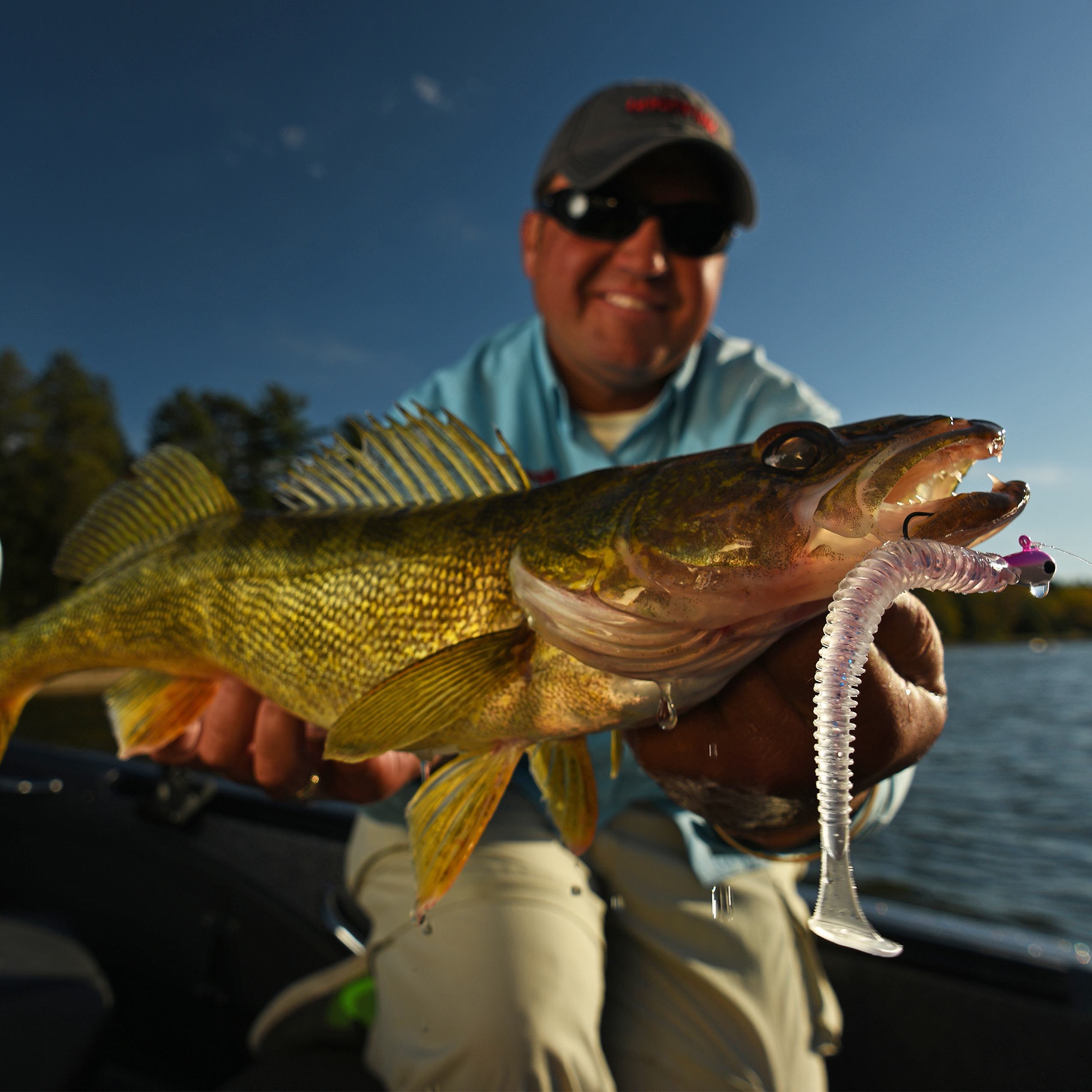 Tony Roach holding up a walleye he caught on a jig and plastic combination.