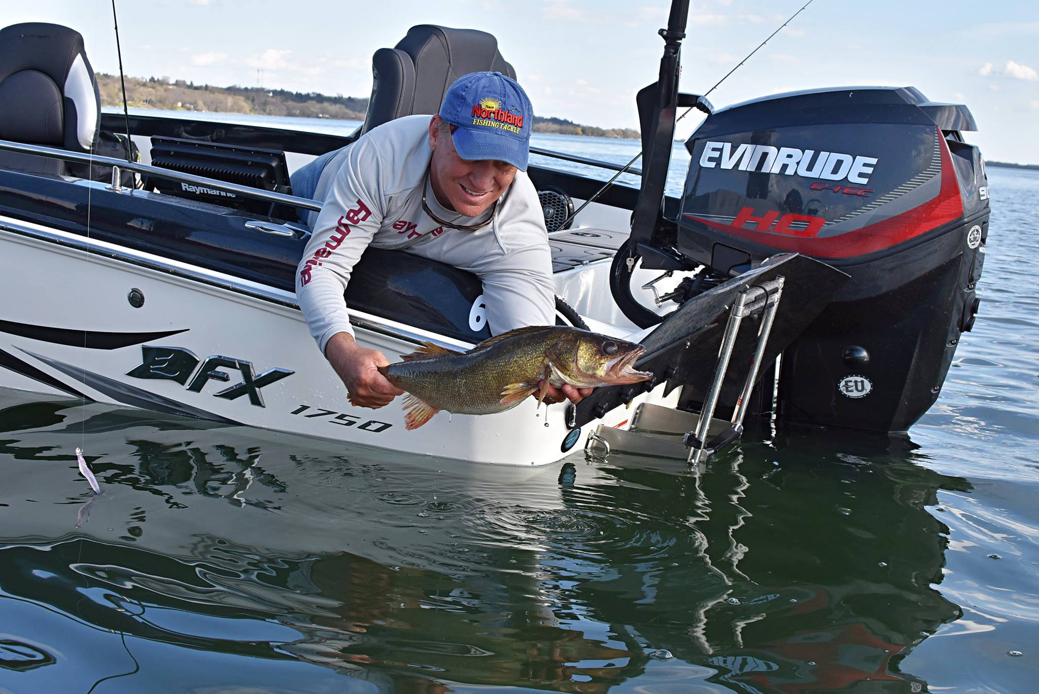 Mike Frisch with a walleye he caught open water fishing.